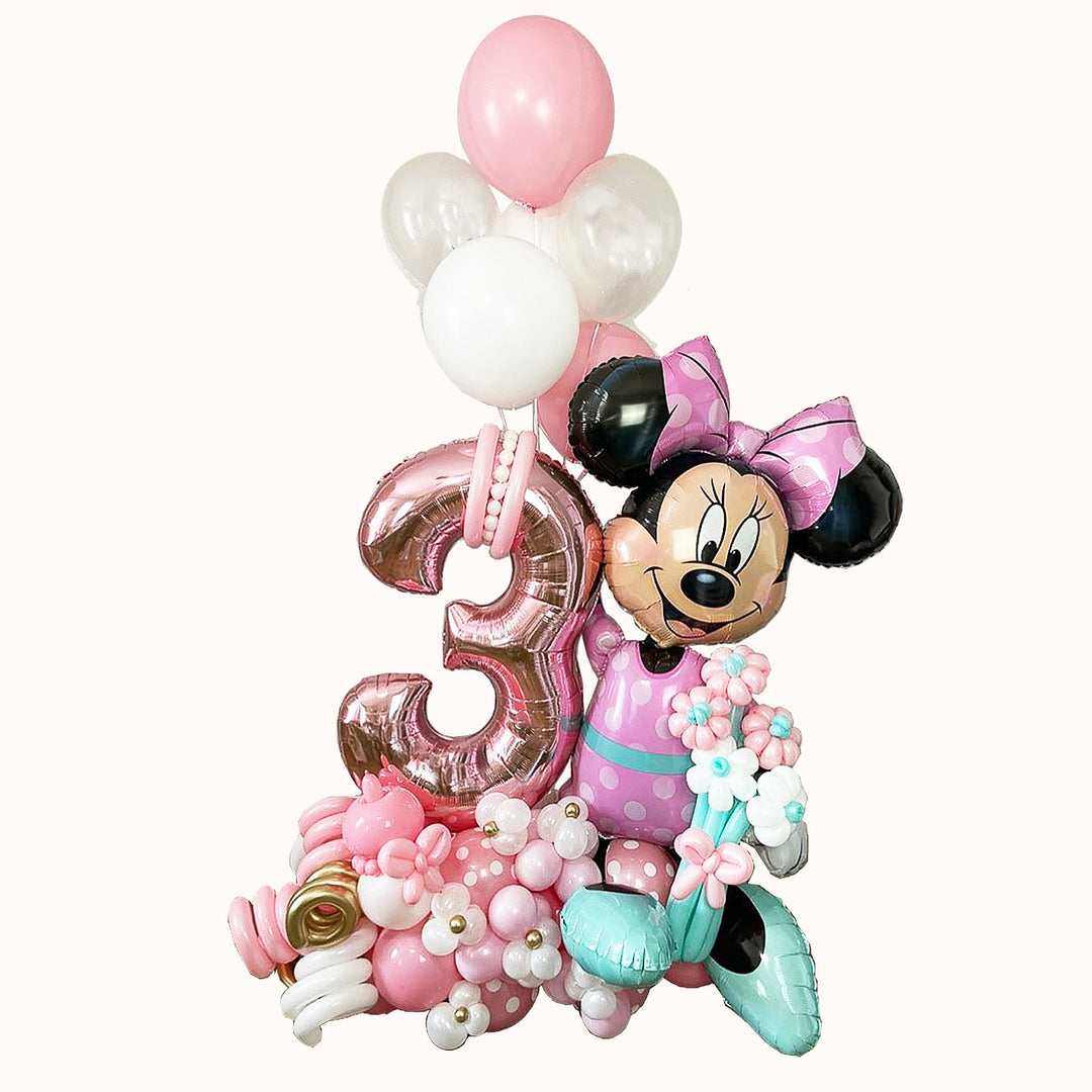 Mural de globos para cumpleaños:1 globo metálico de número grande, 1 globo Minnie extra grande (1.37 m de alto x 96 cm de ancho), 1 ramo de 4 flores de globos, base de globos de látex y 6 globos de látex con helio.