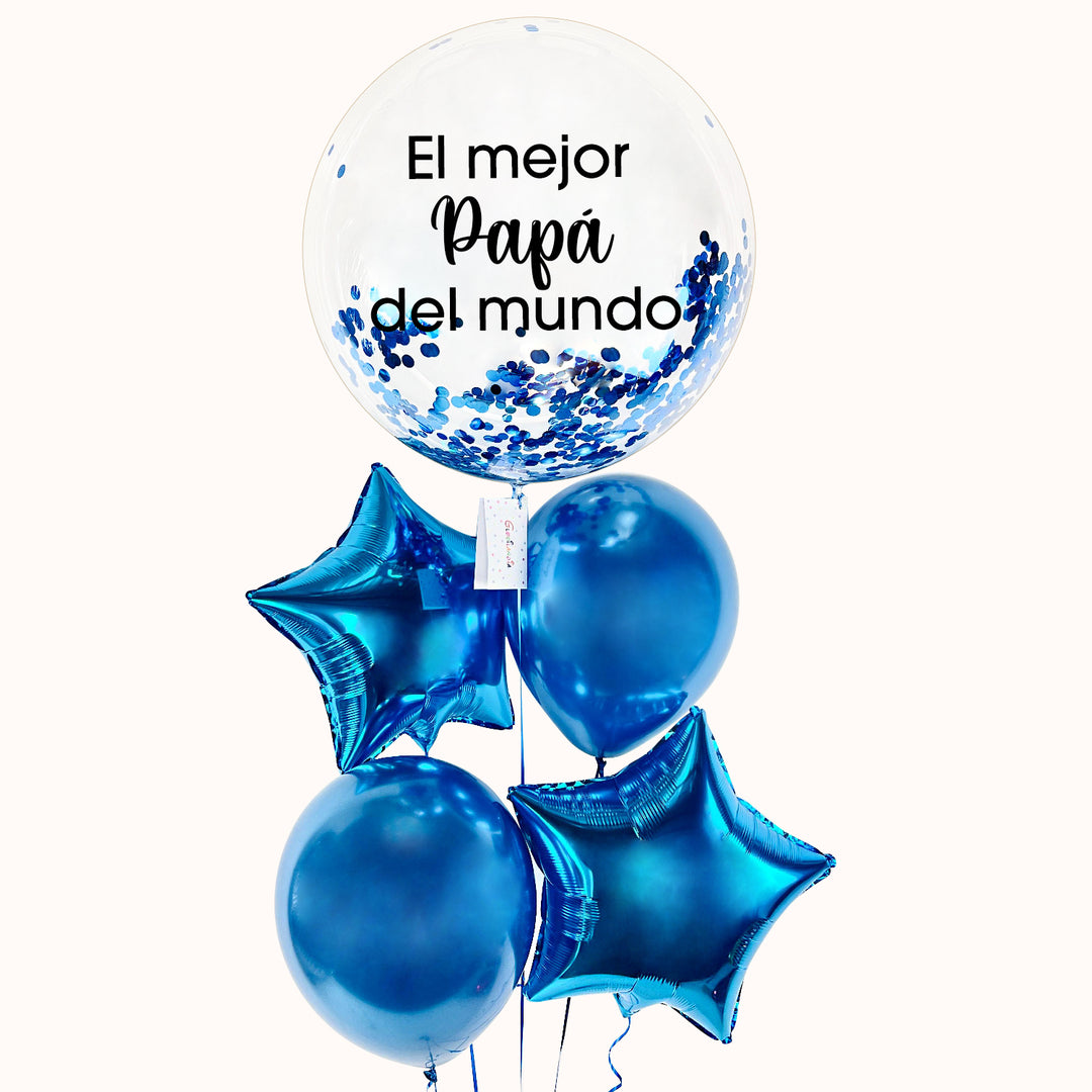 Bouquet en tonos azules que consta de 1 globo burbuja transparente con confeti azul, personalizado con la frase “El mejor papá del mundo”, acompañado de 2 globos metálicos en forma de estrella y 2 globos látex. Todos inflados con helio. Ideal para festejar al padre en su día