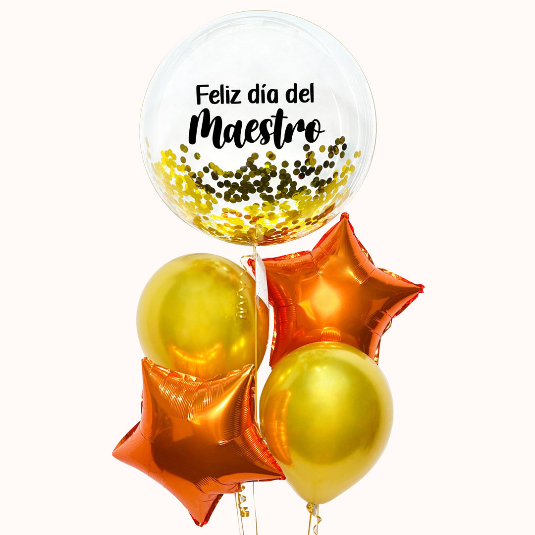Bouquet de globo burbuja transparente con confeti dorado, personalizado con la frase “Feliz Día del Maestro”, acompañado de 2 globos látex y 2 globos metálicos, todos inflados con helio 100% puro. Un detalle ideal para homenajear al maestro en su día.