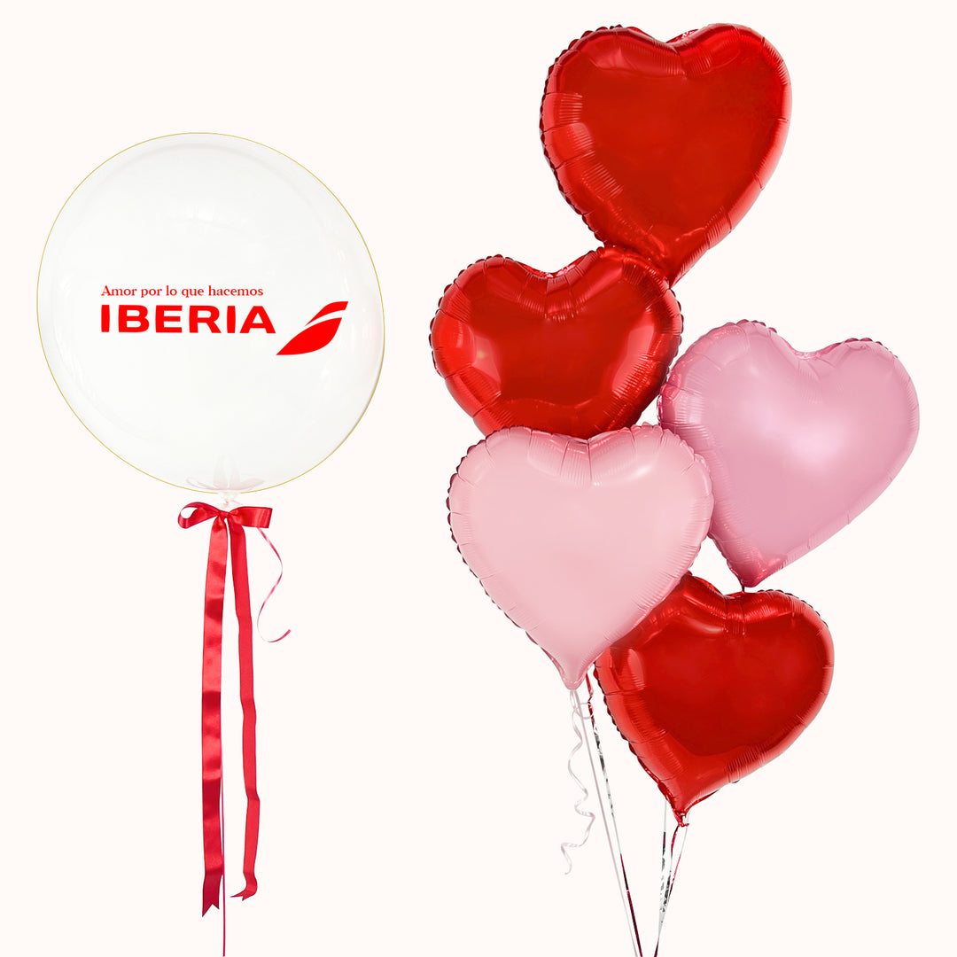 Bouquet de globos para San Valentín: Set de 6 globos con helio: 1 globo burbuja, acompañado de 5 globos en forma de corazón en tonos rojo y rosado.