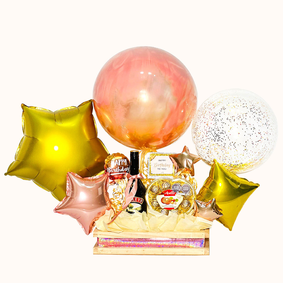 Gift box premium con botella de Baileys 375 mL, chocolates Avellana, globo burbuja personalizado y globo estrella metálico con helio para cumpleaños, aniversarios. Regalos Personalizables en lima.