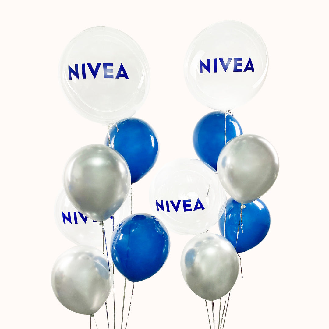 Ramo de 12 globos, distribuidos en 2 ramos: cada arreglo contiene 2 globos personalizados con tu logo y 4 globos de látex. Ideal para la decoración del dia del padre en tu empresa.