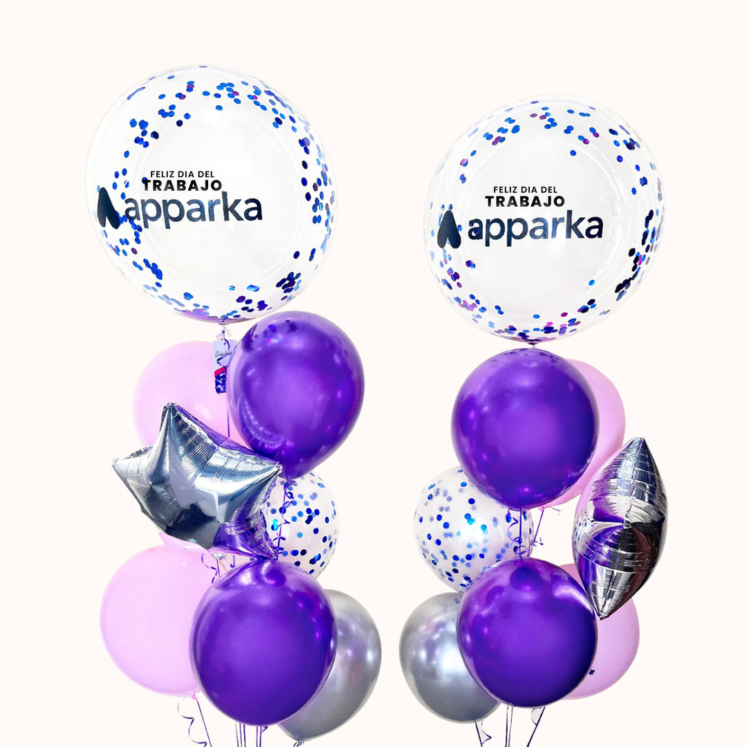 Arreglo corporativo con 2 globos burbuja con escarcha personalizados con logo, 2 globos estrella metálicos, 10 globos de látex en colores a elección y 2 globos con confetti, incluye 2 pesas. Ideal para campañas del Día del Trabajo, elaborado para destacar tu marca.