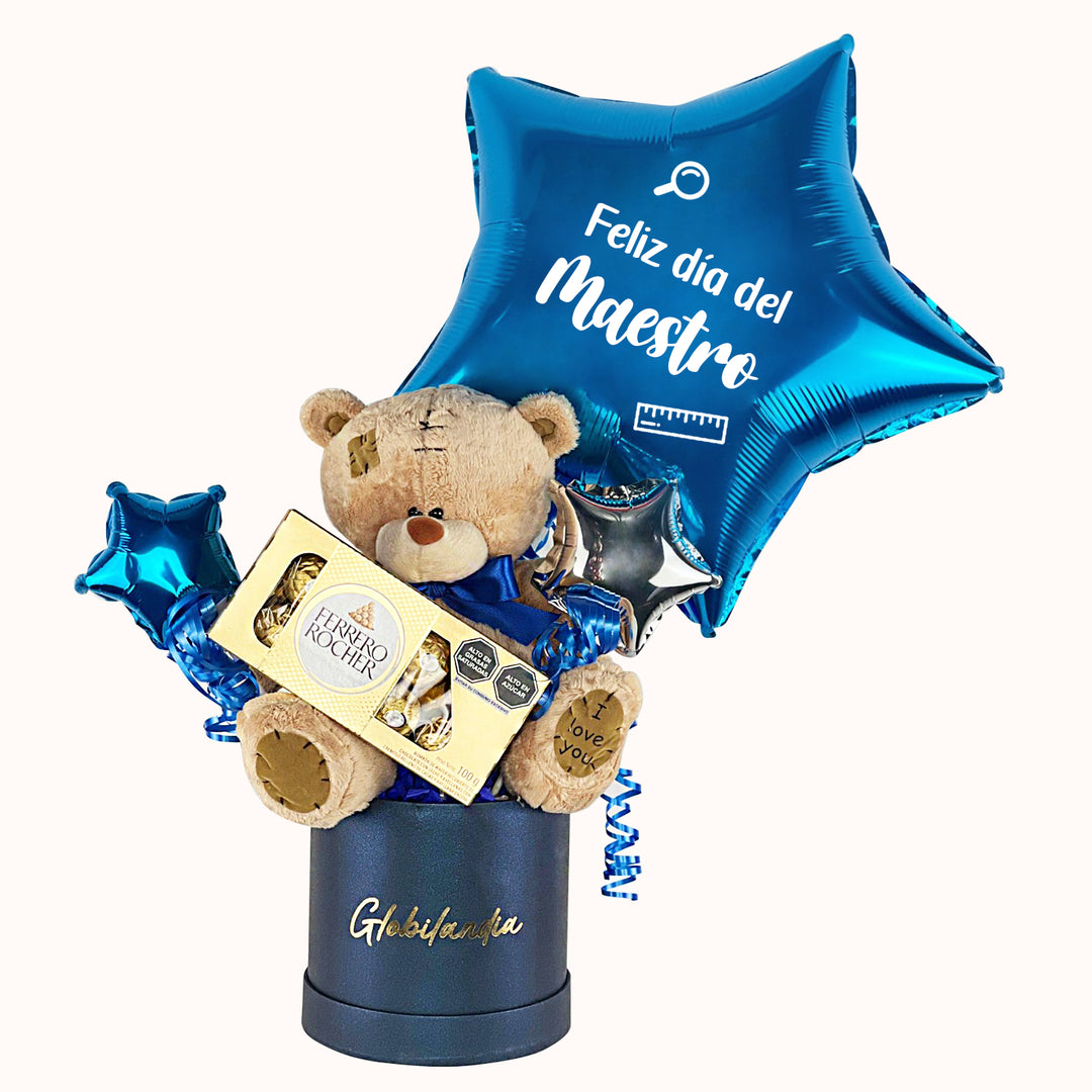 Hermoso arreglo de mesa que incluye chocolates Ferrero Rocher, un oso grande y un globo personalizado con la frase “Feliz Día del Maestro”. Un detalle ideal para homenajear a los profesores en su día.