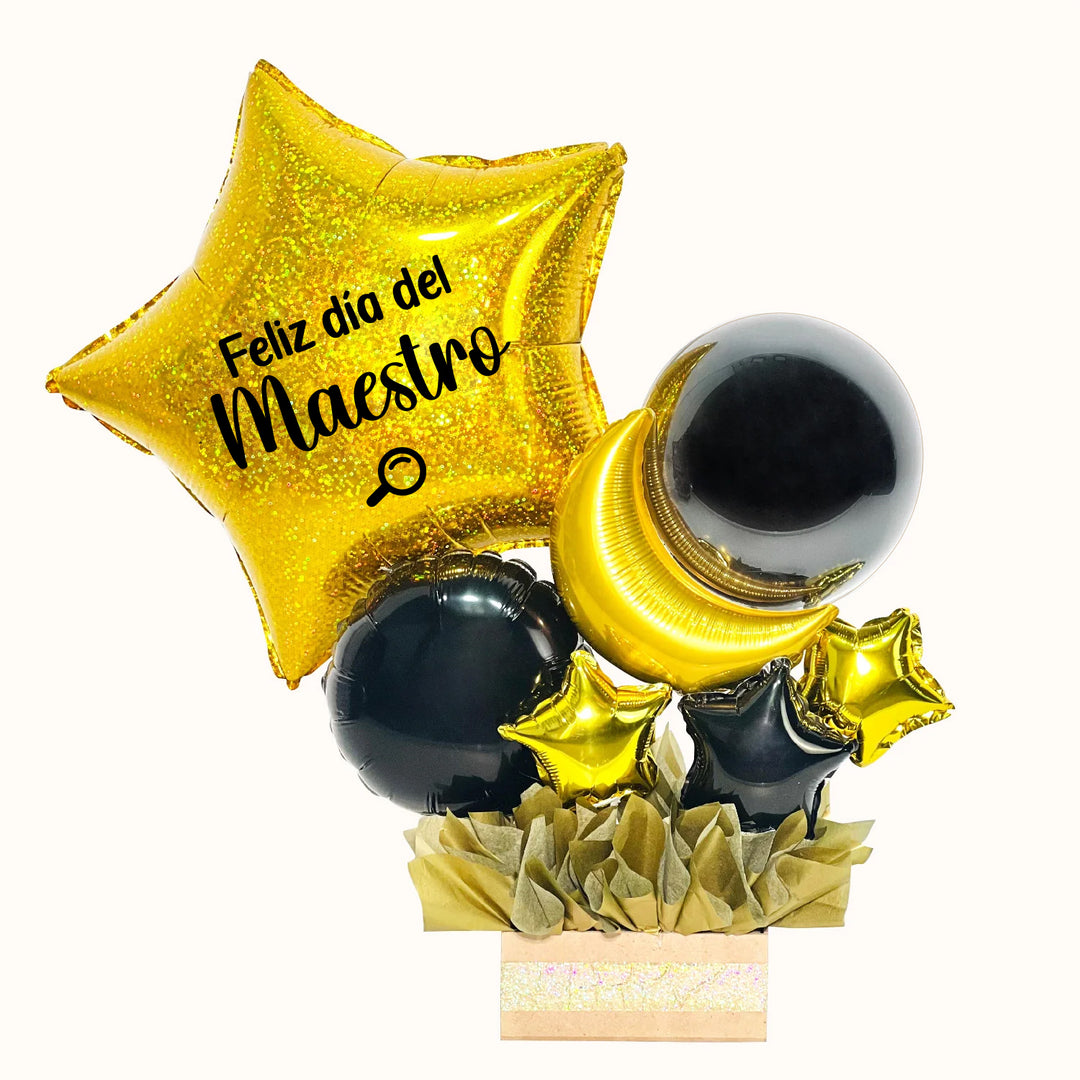 Caja de regalo con globos que incluye 1 globo estrella dorada personalizado con la frase “Feliz Día del Maestro”, 1 globo burbuja y delicados globitos decorativos color negro y color dorado. Un gift box ideal para sorprender y homenajear al maestro o profesor en su día.
