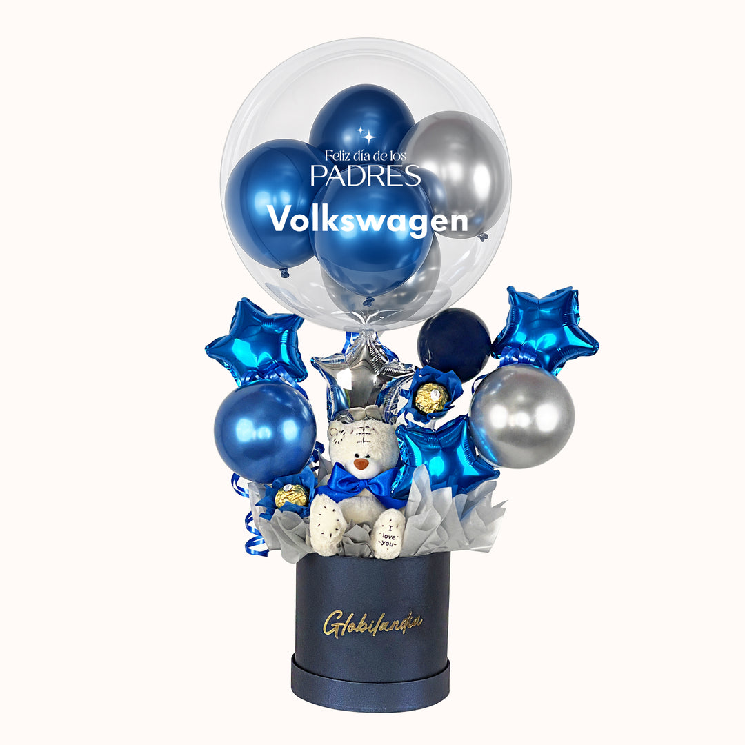 Sorprende a tu equipo con un regalo especial que incluye 1 globo burbuja personalizado con globitos dentro, chocolates Ferrero Rocher, globitos decorativos, un osito de peluche, caja de regalo satinada y tarjeta personalizada; una opción elegante y memorable para celebrar y reconocer a los padres de tu empresa.