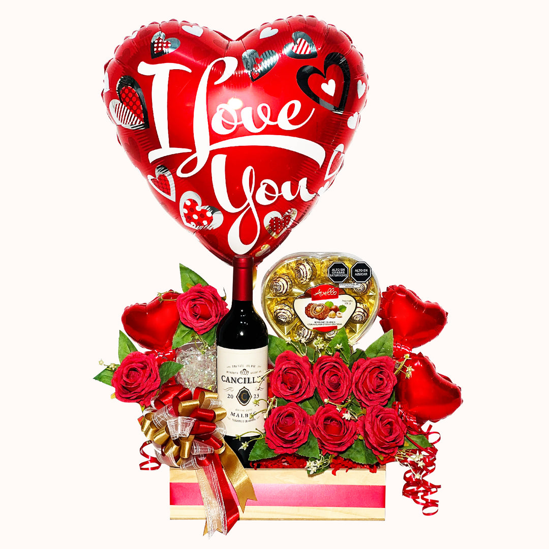 Gift box que incluye caja de chocolates de avellana, rosas artificiales, copa y globos decorativos metálicos. Regalo romantico para novios.