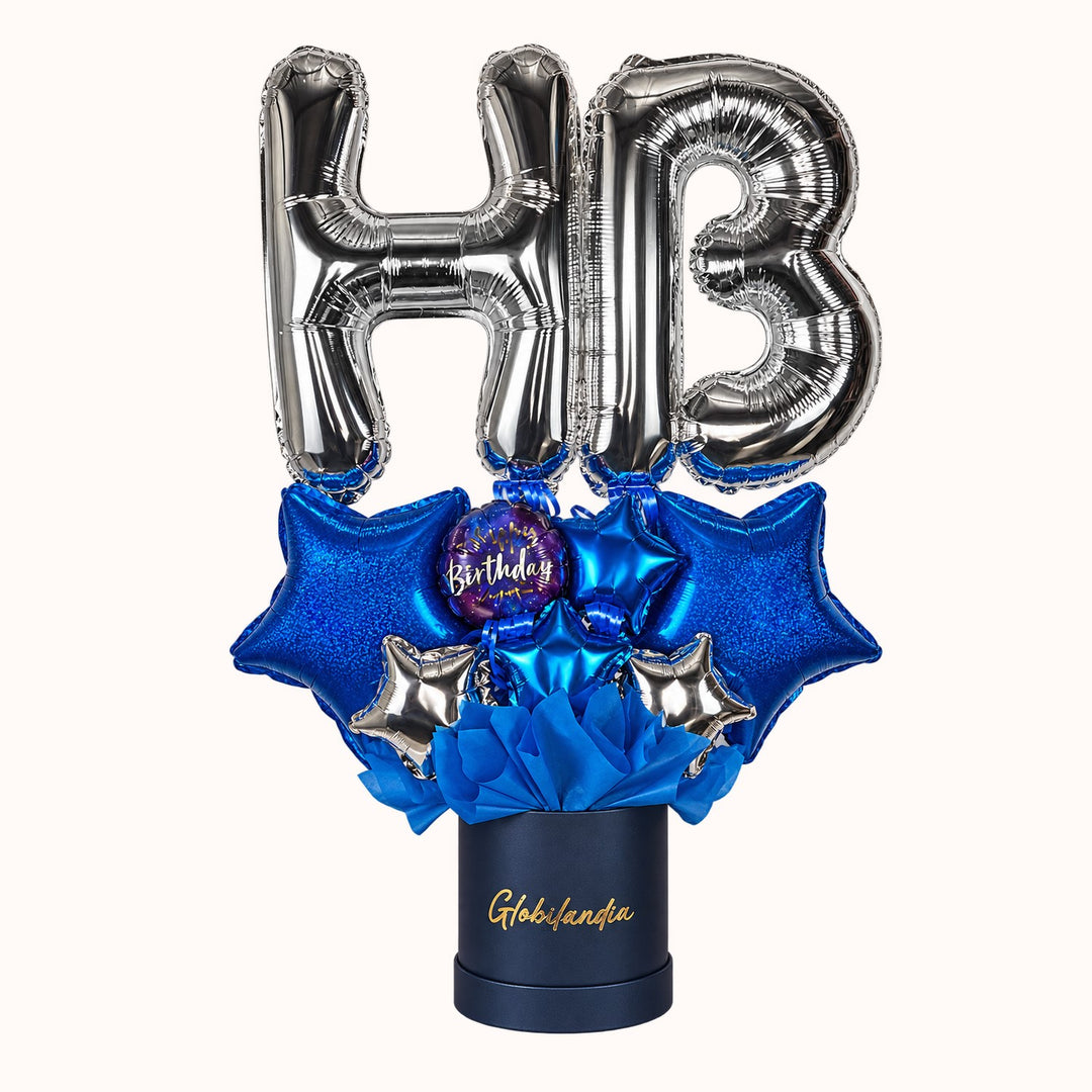 Gift box Happy Birthday  que incluye: 2 globos de letras “HB” pequeñas, varios globos estrella y globitos decorativos pequeños. Un detalle alegre y especial para celebrar cumpleaños.