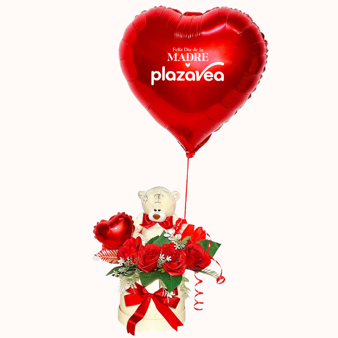 Arreglo corporativo para el Día de la Madre que incluye rosas decorativas artificiales, 1 peluche chico de osito y 1 globo de corazón inflado con helio, con opción de personalizar el globo con nombre, ideal para obsequiar en campañas empresariales.