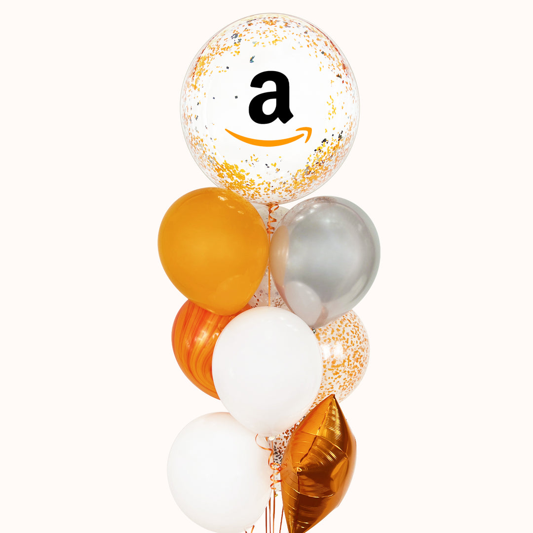 Bouquet de globos con helio que contiene: 1 globo burbuja con escarcha, personalizado con tu logo; 1 globo metálico en forma de estrella, 5 globos de látex y 2 globos de látex con confeti. (colores a elegir) Ideal para promocionar tu empresa de forma creativa y destacar tu evento corporativo.
