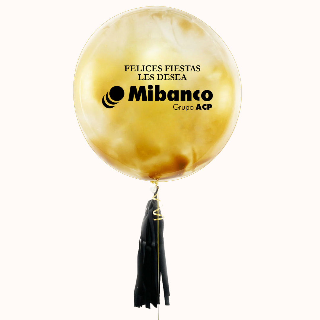 Globo burbuja pintado en color dorado, decorado con un flequillo negro que le da un toque elegante. personalizado con tu marca-logo
