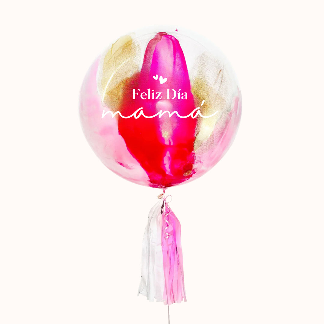 Globo burbuja personalizado, pintado en color dorado, fucsia y dorado  y decorado con flequillo de papel seda en color rosa. Ideal para regalar a mamá en su día.