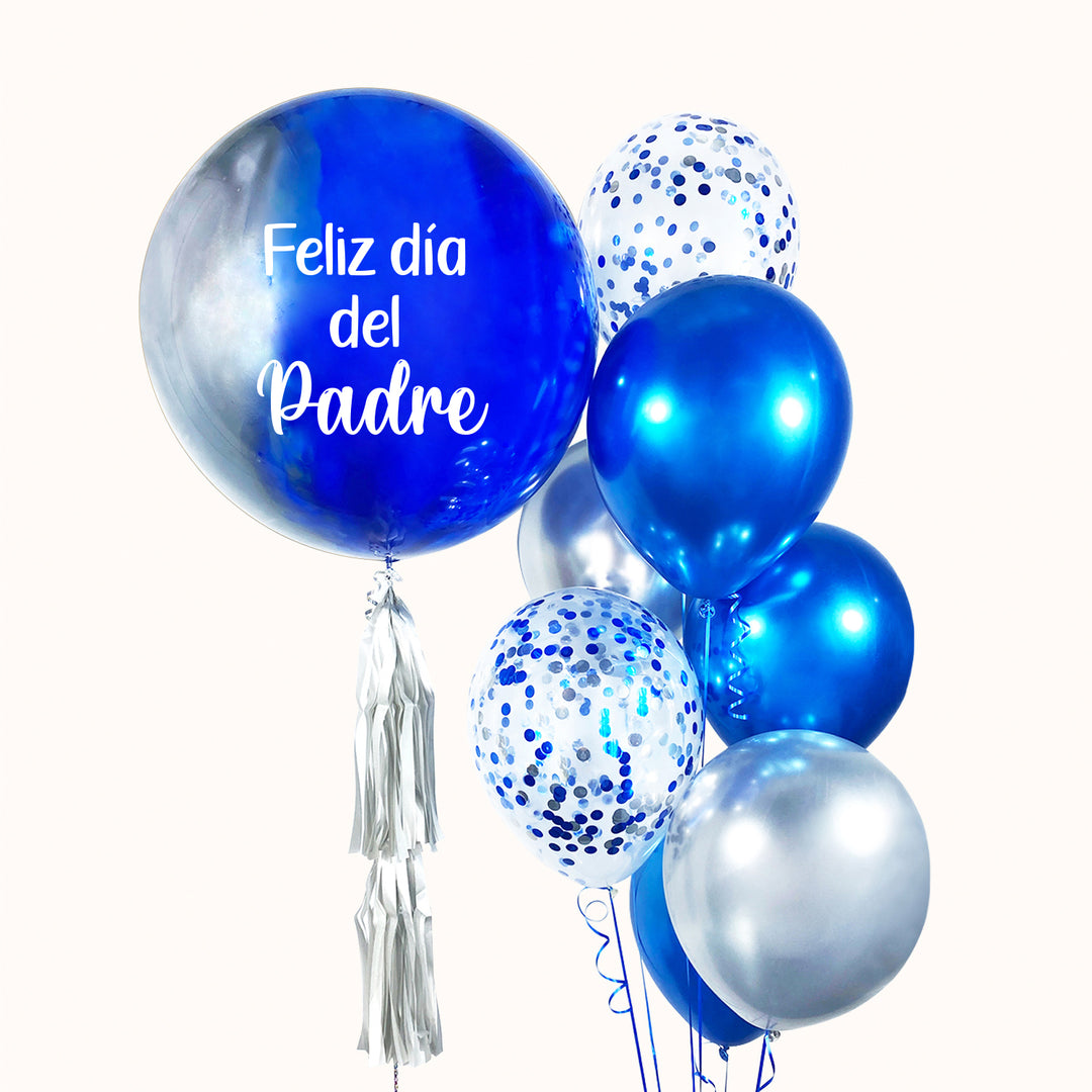 Bouquet de globo burbuja pintado en tonos azules, personalizado con tu logo, acompañado de 5 globos de látex en tonos plata y azul y 2 globos de látex con confeti. Todo inflado con helio puro, ideal para realzar tus eventos corporativos día del padre e impulsar tu marca con estilo.