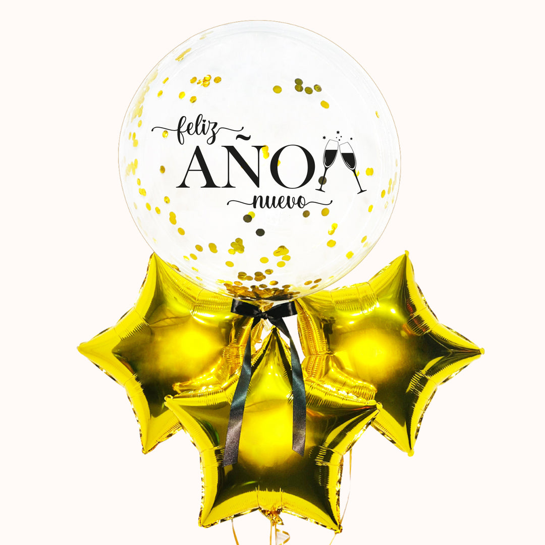 Bouquet de globos con burbuja transparente con confeti, acompañado de 3 estrellas metálicas doradas y lazo de tela negro, personalizado con el mensaje “Feliz Año Nuevo”.