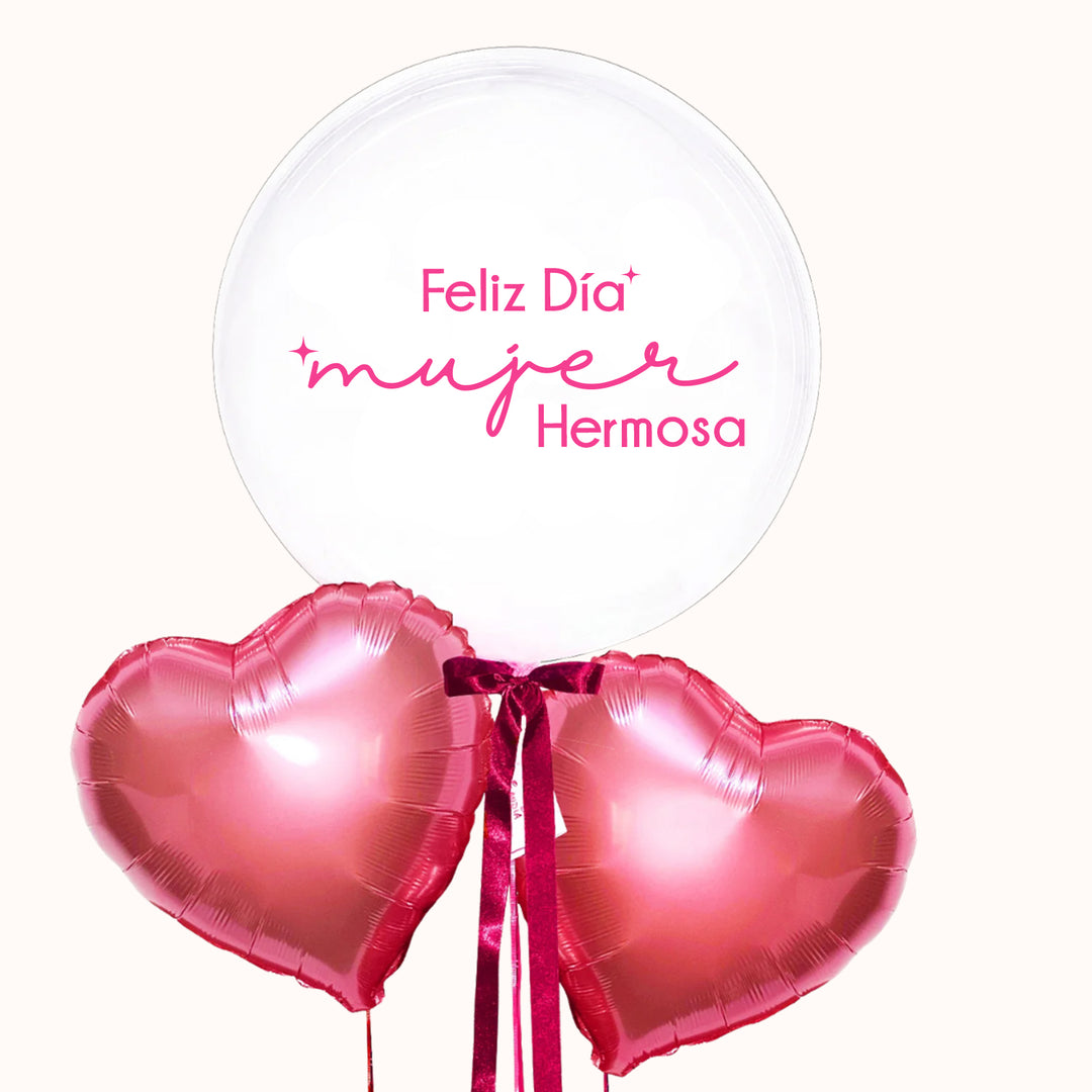 Arreglo de globos con helio para el Día de la Mujer que incluye 1 globo burbuja transparente personalizado y 2 globos en forma de corazón, ideal para celebraciones y obsequios.