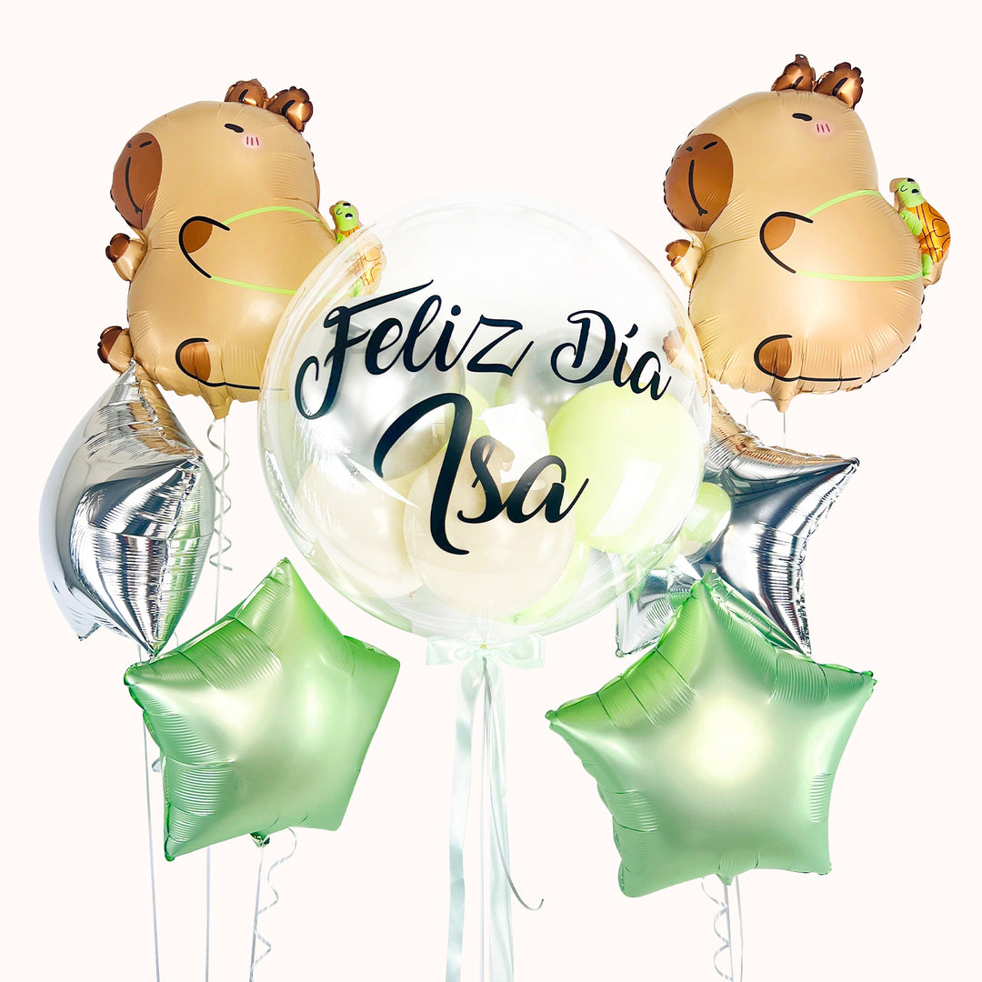 Pack de 7 globos con helio: 1 globo burbuja con globitos en su interior, personalizado; 4 globos en forma de estrella y 2 globos de capibara. Ideal para cumpleaños o cualquier ocasión.