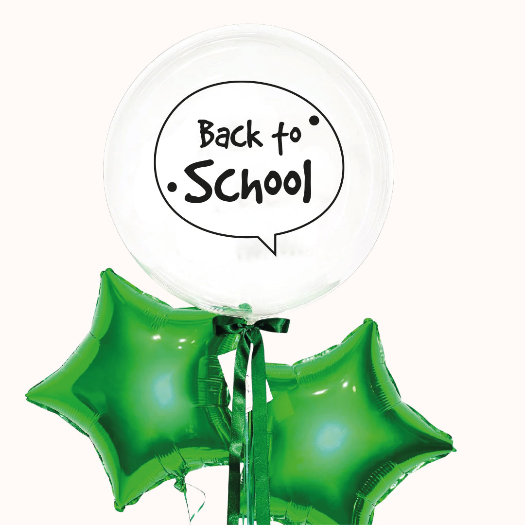 Arreglo de globos con helio para Regreso a Clases que incluye 1 globo burbuja personalizado y 2 globos metálicos en forma de estrella, ideal para celebraciones y activaciones especiales.