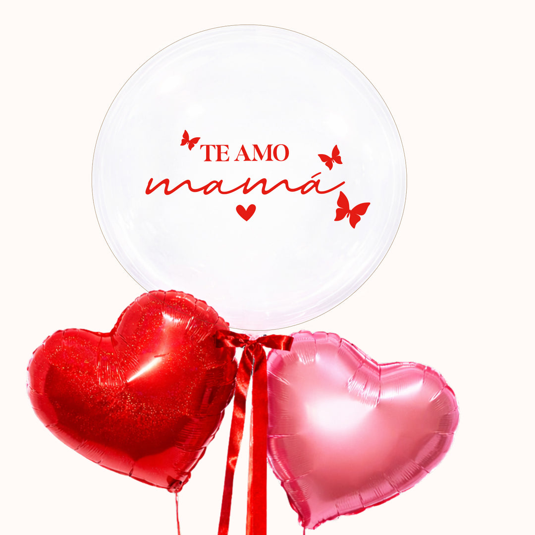 Bouquet arreglo de globo burbuja transparente personalizado "Te amo mamá", 2 corazones metálicos en tonos rosado y rojo. Ideal para obsequiar a mamá en su día.