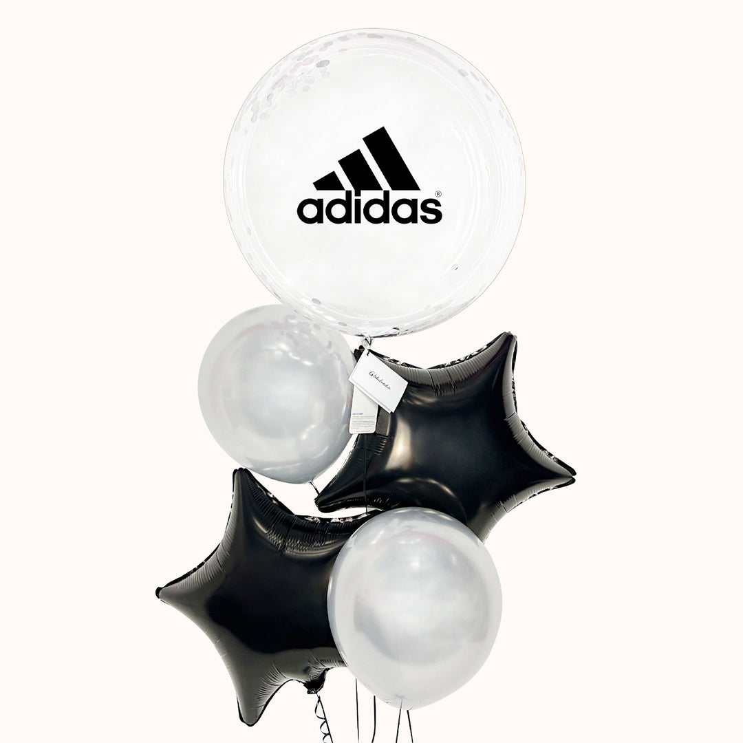 Bouquet con globo burbuja con globo interno, acompañado de 2 globos metálicos en forma de estrella en colores a elegir y 2 globos de látex. Ideal para eventos corporativos, donde se destaque tu marca.