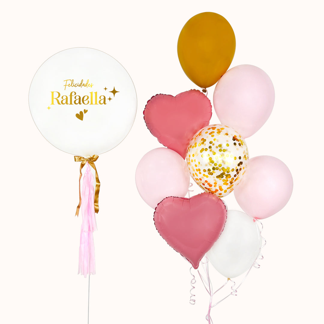 Bouquet de 8 globos con helio: 1 globo burbuja con globo interno, ramo de 2 globos corazón metálico, 4 globos de látex y 1 globo con confeti. En color rosado, blanco y dorado. Ideal para desear felicidades en cumpleaños o cualquier ocasión especial.