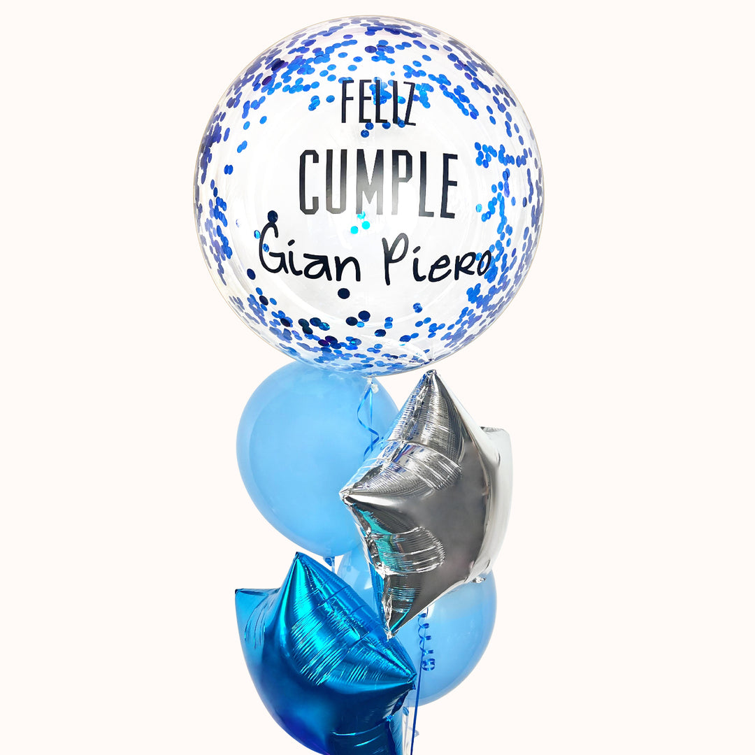 Arreglo de globos con helio para cumpleaños que incluye 1 globo burbuja personalizable, 2 globos estrella, 2 globos de látex color sólido y 1 pesa. Personaliza el globo con un nombre o mensaje para crear un detalle único. Ideal para decorar celebraciones de cumpleaños, sorprender a un ser querido o complementar la decoración de fiestas y eventos.