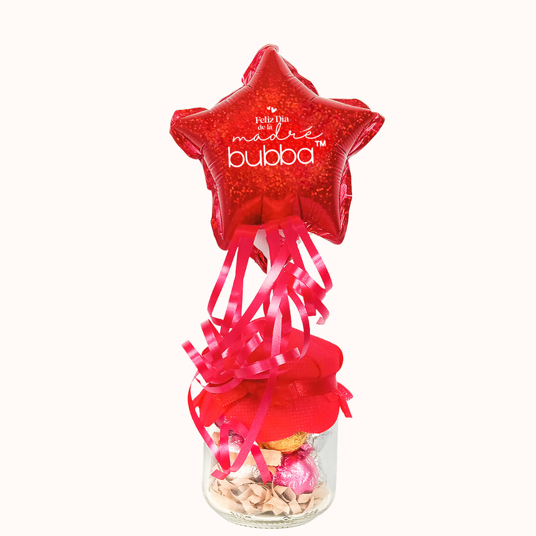 Pomo de vidrio relleno con chocolates Bolobol, acompañado de globo personalizado con tu logo. Ideal como regalo del día de la madre para colaboradores y clientes.