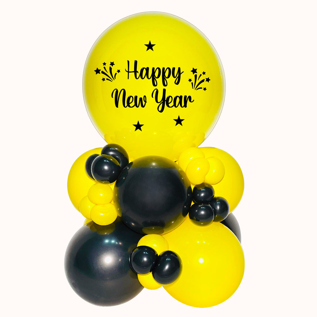 Mini mural amarillo y negro con burbuja personalizada happy new year. ideal para decorar y festejar año nuevo.