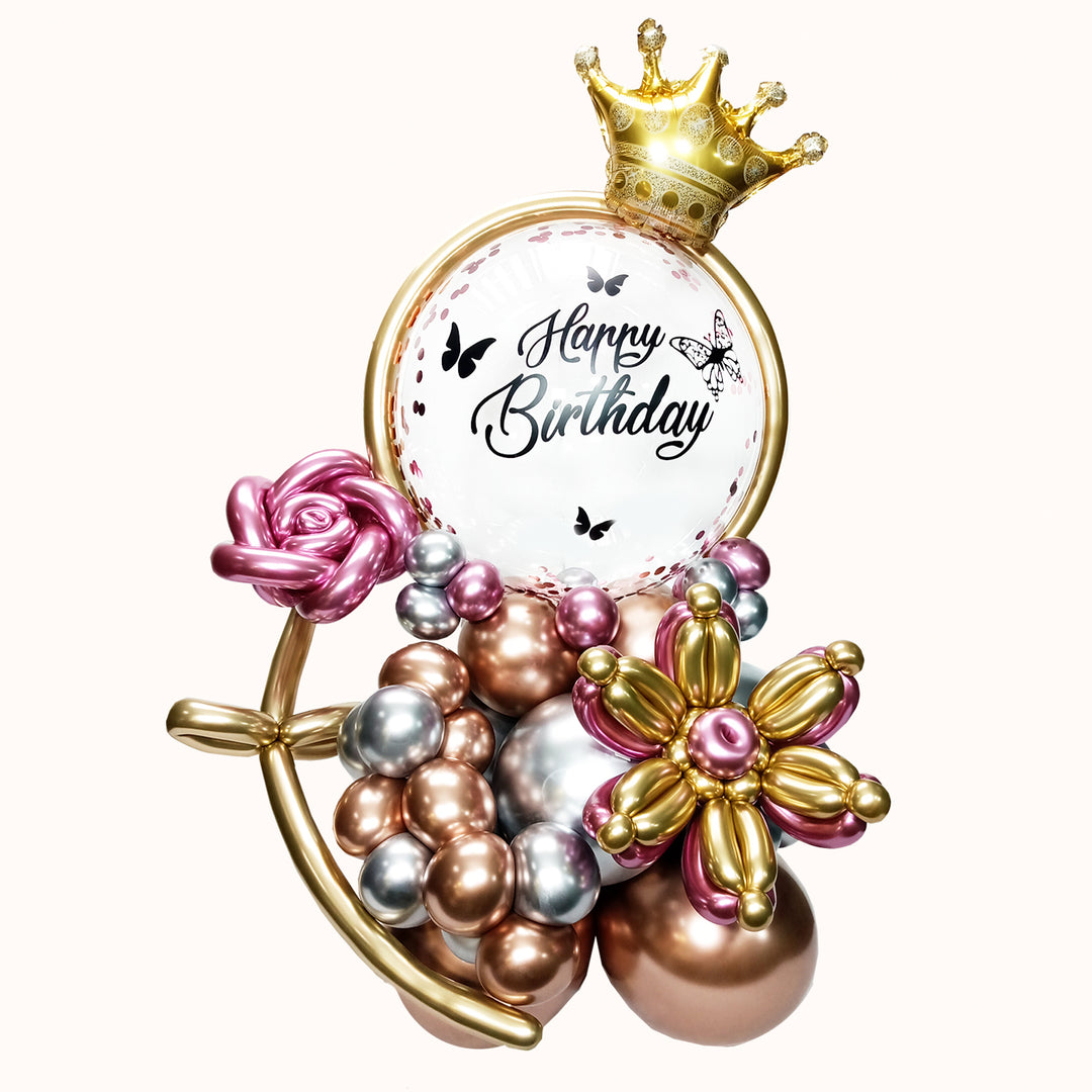 Mural de globos que incluye 1 globo burbuja con confetti personalizado, 2 flores de globos, 1 globo corona y base de globos de látex, ideal para cumpleaños y ocasiones especiales.