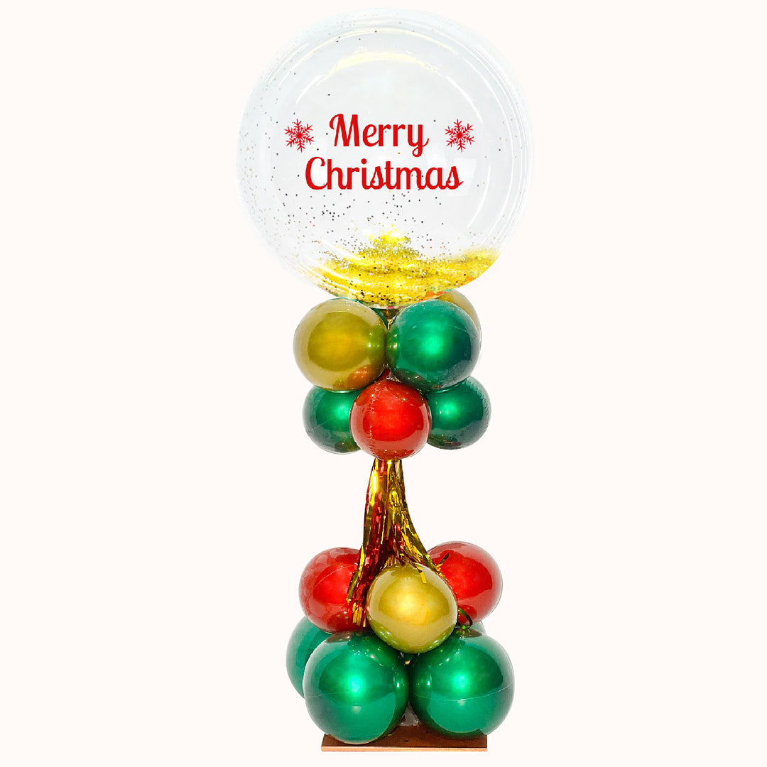 Parante pequeño con globo burbuja transparente, personalizado con la frase “Merry Christmas”. Ideal para decorar eventos corporativos navideños. Incorporamos tu marca para promocionar tu empresa de forma creativa.