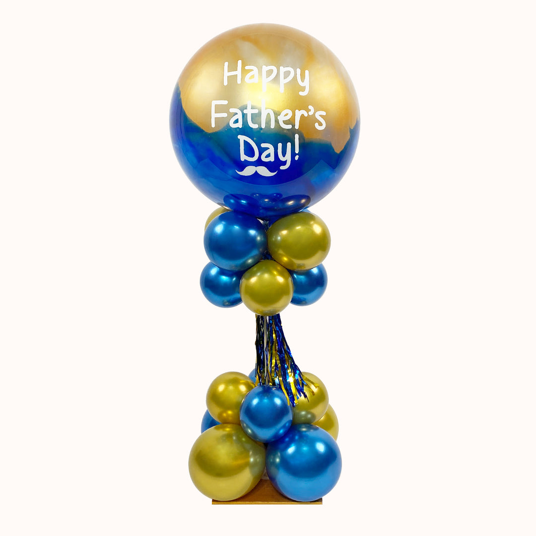 Parante chico con base de globos de látex de 94cm, 1 globo burbuja pintado y personalizado. Ideal para decorar celebraciones corporativas especial. Día del Padre.
