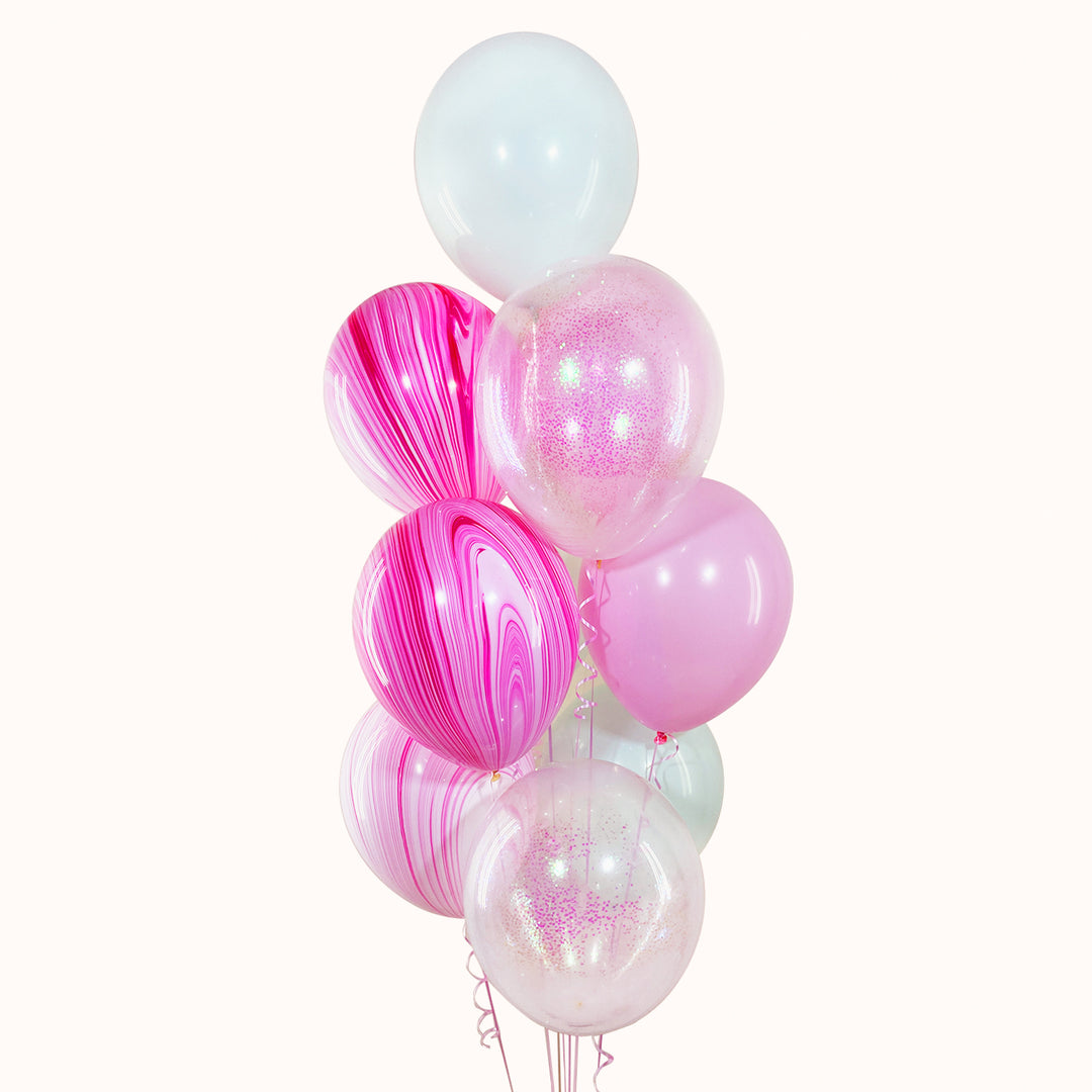 Bouquet de 9 globos con helio: 4 globos de látex en color sólido, 3 globos de látex ágata y 2 globos de látex transparentes con confetti. Ideal para Cumpleaños o cualquier ocasión especial.
