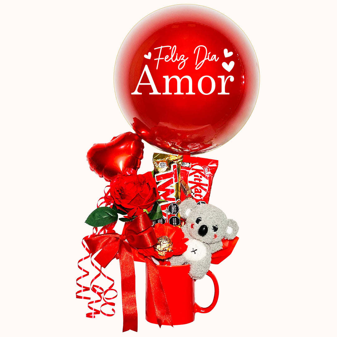 Bella taza roja, delicadamente decorada, que incluye un tierno peluche de animalito, chocolates, una rosa y globitos decorativos, con un hermoso personalizado que dice “Feliz Día, Amor”. Un detalle perfecto para sorprender y enamorar.